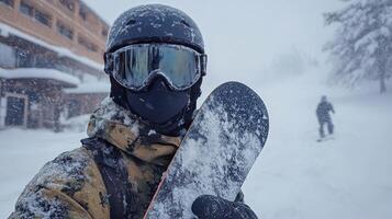 Snowboarder in winter gear enjoys a snowy day on the mountain with fresh powder falling photo