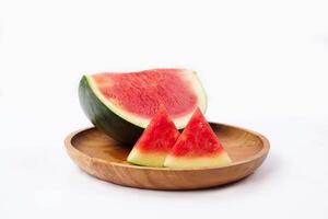 Whole watermelon and seeded slices seen front and top on a white background. Watermelon slices are red, seedy and juicy. photo