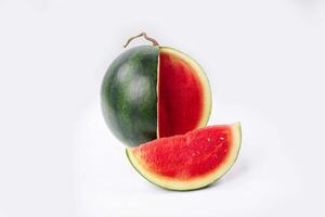Whole watermelon and seeded slices seen front and top on a white background. Watermelon slices are red, seedy and juicy. photo