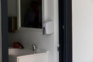 Modern Restroom With Sleek Decor Featuring Minimalistic Design Elements and Natural Light, Creating a Calming Atmosphere photo
