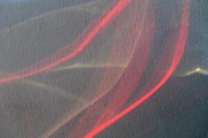 Abstract Light Trails Create a Dynamic Interplay of Colors Against a Textured Surface in an Artistic Display at Twilight photo