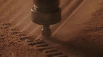 Carving geometric pattern on wooden sheet with small drill at woodwork factory, macro view. Creative. Wood lathe machine processes detail creating sawdust. video