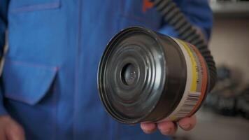 Close up of fireman holding professional filter of labor protection. Clip. Detail of emergency workers routine. video