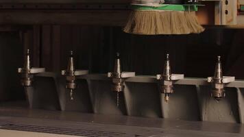 Cleaning and processing of wood with special tools. Creative. A woman in a special uniform cleans and processes thin finished boards with the help of equipment. video