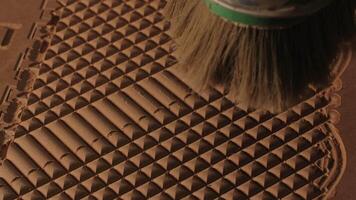 Close up of blowing away the dust from a wooden carved board with air flow. Creative. Industrial background, concept of carpentry. video