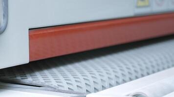 Close up of industrial working machine at the workshop. Creative. Moving production line with grey material. video