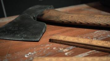 Big axes. Media. Huge Russian axes that lie on the tables and are removed at a close angle. video