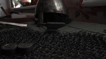 Ancient Russian decorations. Media. A table with a big sword and an iron shelom which. video
