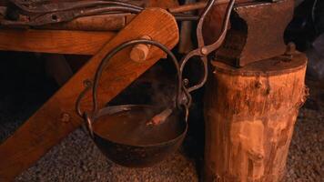Working with split iron. Media. A man is a blacksmith who forges iron on the street at a split temperature. video