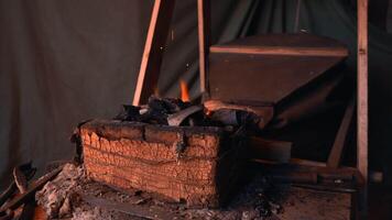 Hard work with iron. Media. A man on the street in a hat is working with fire and iron. video