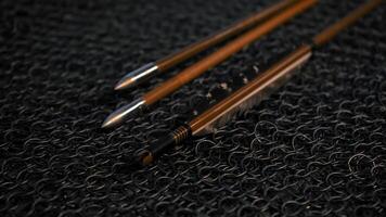 Thin arrows. Media. An iron table with small thin sharpened arrows. video