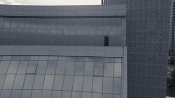 A huge black building. Stock footage. The newest building with huge black windows against a white sky. video