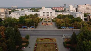 Bird's-eye view of the parks. Stock footage. Small white buildings around parks with green trees. video