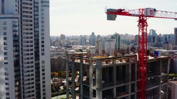 Beautiful bright view of the built-up city. Stock footage. Tall buildings located on the river bank in the city center with overgrown trees. video