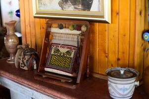 Artisan weaving loom displayed in a cozy rustic home setting, showcasing traditional craftsmanship and decor photo