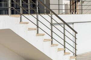 Modern Staircase With Sleek Railings Showcasing Minimalist Design Elements in a Bright Outdoor Setting photo