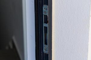 A Close-Up View of an Installed Door Lock Mechanism Showcasing Precision Craftsmanship in a Modern Home photo