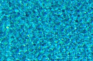 A Vibrant Turquoise Pool With Sparkling Water Reflections Inviting Summer Relaxation and Enjoyment on a Sunny Day photo
