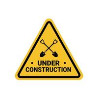under construction on a building, shovels crossed on a yellow triangle sign. Suitable for posters and web icons vector