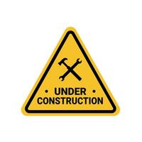under construction in a building, a hammer and key crossed on a yellow triangle sign. Suitable for posters and web icons vector