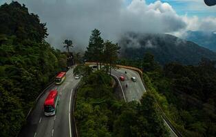 The stunning view in Genting highlands from a cable car with a foggy in the background, Rainforest, Malaysia. Bird's eye view. Aerial view. photo