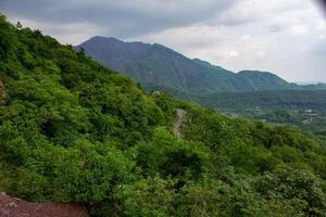 A view of a mountain range from a hillside photo