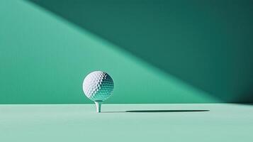A minimalist shot of a golf ball on a tee set against a teal background, highlighting its textured surface and casting a soft shadow, perfect for sports-themed designs. photo