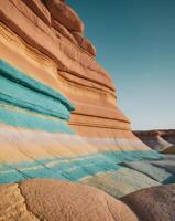 A colorful rock formation in the desert photo