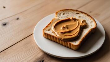 A piece of bread with peanut butter on it photo