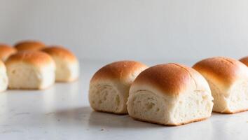 A group of small rolls sitting on a table photo