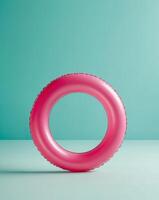 A pink inflatable ring sitting on a table photo