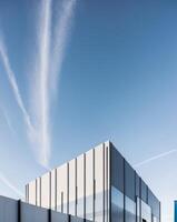 A building with a blue sky and white clouds photo