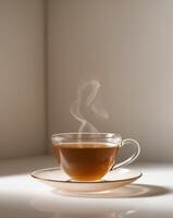 A cup of tea with steam coming out of it photo
