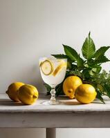 Lemonade with fresh herbs and lemons on a table photo