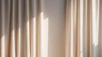 A room with a white wall and a window with curtains photo