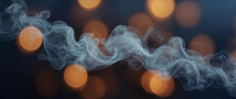 Smoke is seen in the air in front of a blue background photo