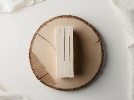 A stack of books on a wooden plate photo