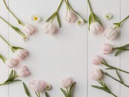 Pink tulips arranged in a circle on a white wooden table photo