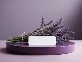 Lavender flowers and blank card on purple table photo