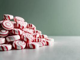 A pile of red and white candy canes photo