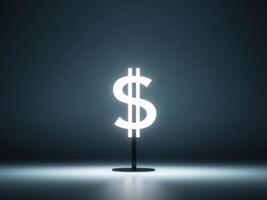 A dollar sign on a table in front of a dark background photo