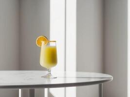A glass of orange juice on a table photo
