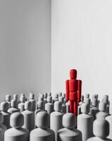 A red man stands out from a crowd of people photo