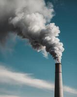 A large smoke stack coming out of a factory photo