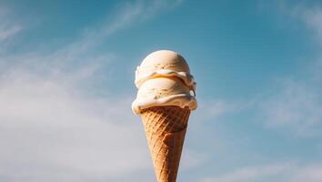 A cone of ice cream is being held up in the air photo