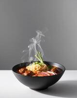 A bowl of noodles and meat with steam coming out of it photo