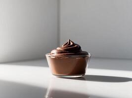 Chocolate pudding in a small glass bowl photo