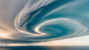 A large storm cloud is seen over the ocean photo