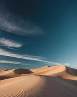 A desert with sand dunes and clouds photo