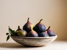 Figs in a bowl on a table photo